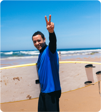 Surfer walking on the beach